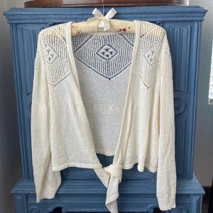 Cream colored long sleeve cropped sweater shrug